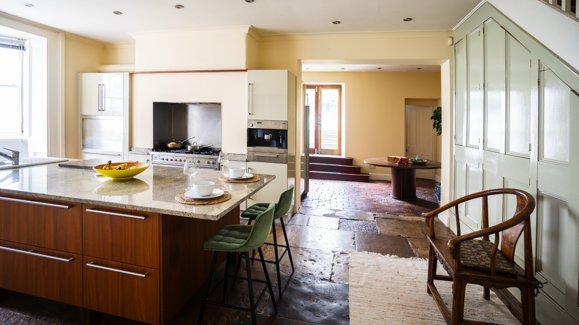 Large kitchen with island bathed in natural light